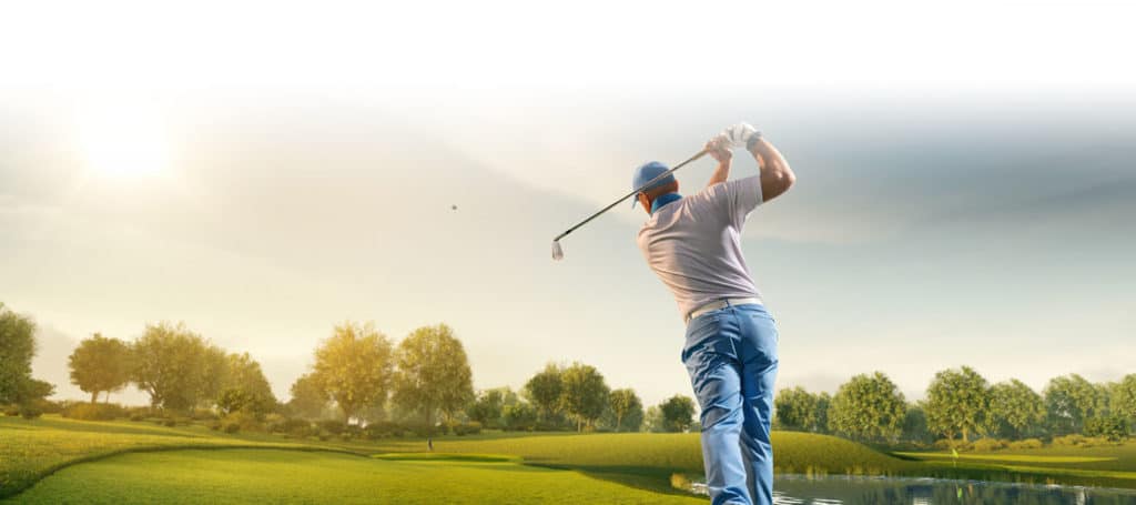 Mature individual golfing on scenic course