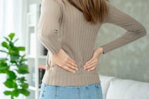 Woman holding lower back