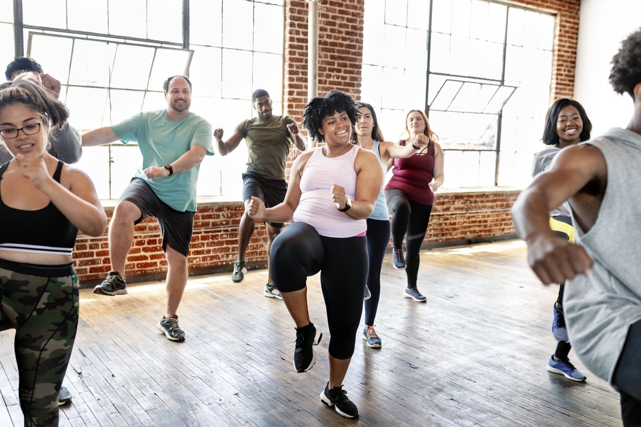 Multiple active adults in fitness class